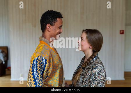 Smiling couple in yoga studio Stock Photo