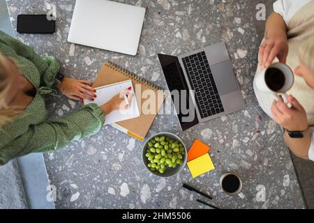 High angle view of women working together Stock Photo