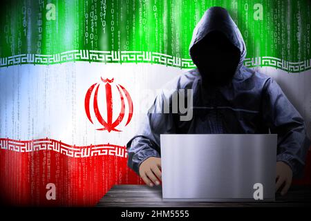 Anonymous hooded hacker, flag of Iran, binary code - cyber attack concept Stock Photo