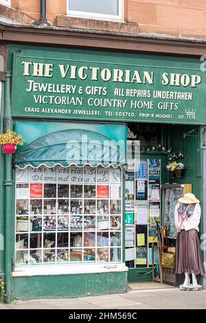 Shop window in Rothesay Isle of Bute with notices warning about ...