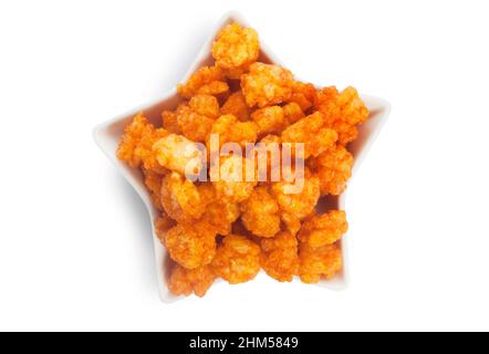 Studio shot of chilli flavoured rice crackers cut out against a white background - John Gollop Stock Photo