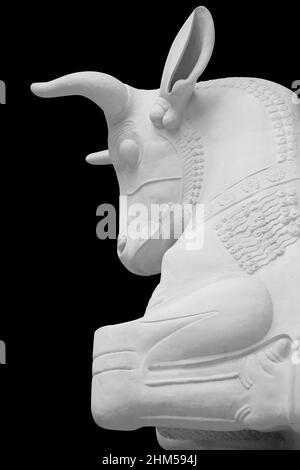 Stone statue. Bull isolated on a black background with clipping path Stock Photo