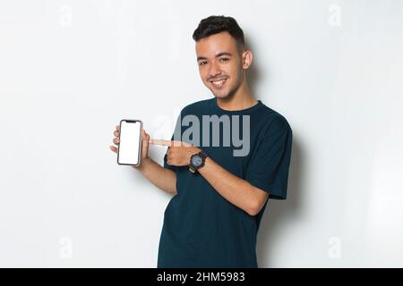 young man demonstrating mobile cell phone on white background Stock Photo