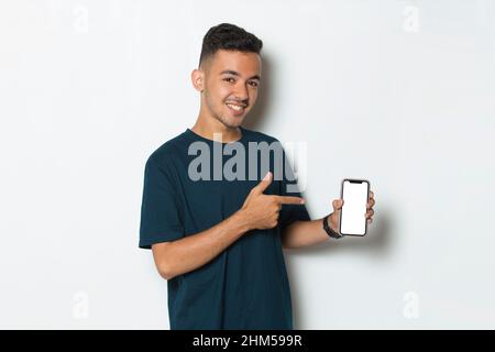 young man demonstrating mobile cell phone on white background Stock Photo