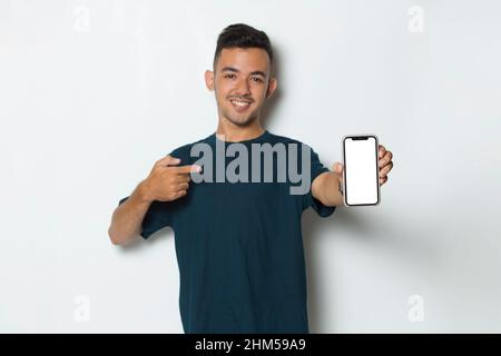 young man demonstrating mobile cell phone on white background Stock Photo