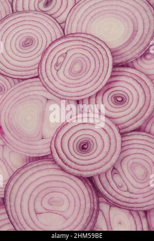 Onion slices as a background. Top view. Stock Photo