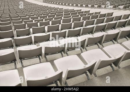 Stadium seats. Empty rows of seating in sports stadium, Barcelona, Spain.Olympic Parc de Montjuic, Landmark no people Stock Photo