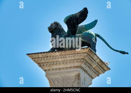 Column with the Winged Lion of San Marco (Leone di San Marco or Leone Marciano) symbol of the Serenissima and the Mark of the Evangelist. Venice, on s Stock Photo