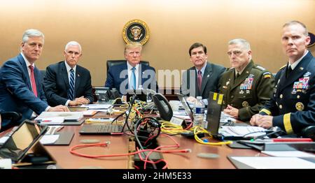 ABU BAKR al-BAGHDADI  (1971-2019)  US President  Donald Trump centre watches coverage of his killing by US Special Forces  on 27 October 2019 flanked by from left, Robert O'Brien, (National Security Adviser), Mike Pence, (Vice-President), Mark Esper( Defence Secretary), General Mark Milley (Chairman of the Joint Chiefs of Staff) Brg. Gen. Marcus Evans (Deputy Director for Special Operations).  Photo: Shealah Craighead/White House. Stock Photo