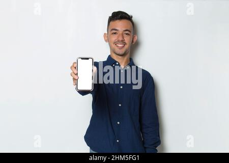 young man demonstrating mobile cell phone on white background Stock Photo