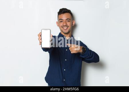 young man demonstrating mobile cell phone on white background Stock Photo