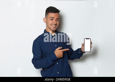 young man demonstrating mobile cell phone on white background Stock Photo