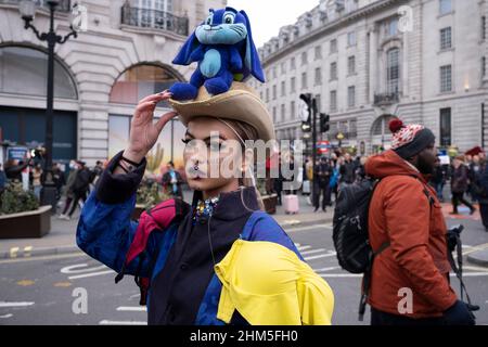 Model from a flash mob fashion show on Piccadilly Circus for designer Pierre Garroudi poses on 22nd January 2022 in London, United Kingdom. Stock Photo