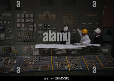 Workers decipher complex diagrams in control room 3 at the Chernobyl ...