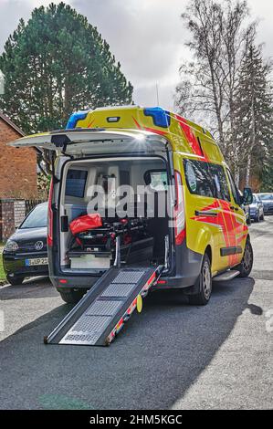 Berlin, Germany - February 7, 2022: Ambulance in action on a side street in Berlin. Stock Photo