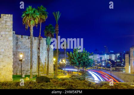 Night view of the walls of the old city, with car lights trails, in Jerusalem, Israel Stock Photo