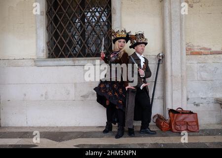 A masked reveller takes part in the Carnival in Venice Stock Photo