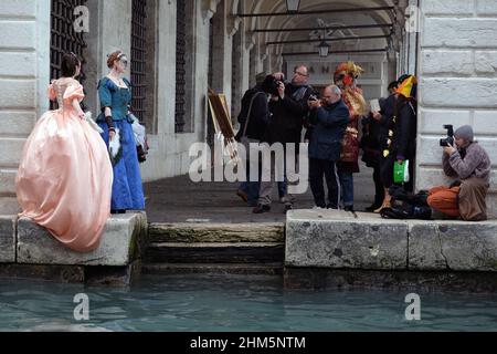 A masked reveller takes part in the Carnival in Venice Stock Photo