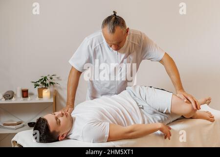 SPA and health. Manual back massage. A man on a massage couch