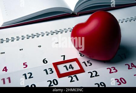 14 february and one large red on a wall calendar with date close up Stock Photo