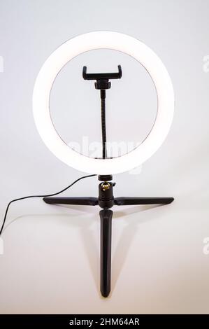 Ring lamp on a small tripod. White light. Stock Photo