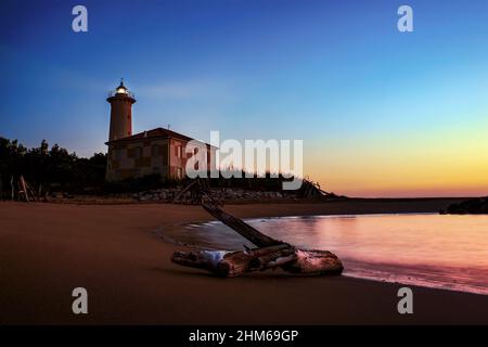 Lighthouse with beautiful sunrise Stock Photo
