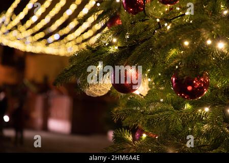Decorations hanging on the Christmas tree in the square of Montepulciano Stock Photo