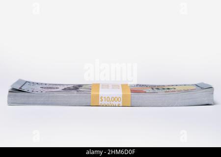 Stack of $ 10,000, ten thousand dollars, isolated on a white background Stock Photo