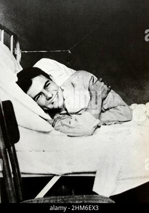 The american writer Ernest Hemingway, author of For Whom the Bell Tolls and The Old Man and the Sea, in a Red Cross hospital aged 19. Stock Photo