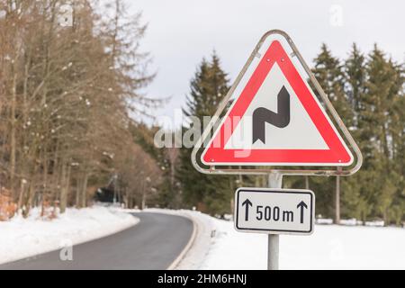 Reverse curve sign on the road shot in winter Stock Photo