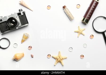 Frame made of travel items, starfishes and seashells on white background Stock Photo