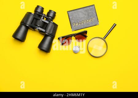 Set of travel items with sunglasses and passport on yellow background Stock Photo
