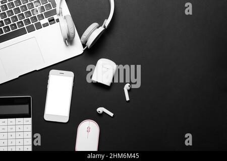 Different gadgets on dark background Stock Photo