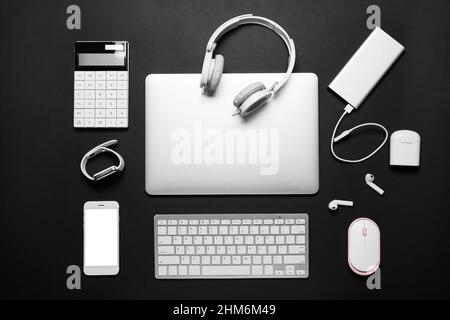 Many different gadgets on dark background Stock Photo