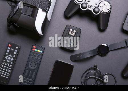 Different modern gadgets on dark background Stock Photo