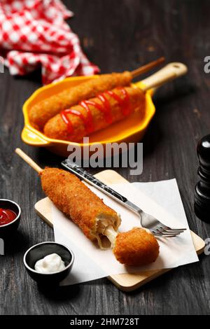 Corndog with Mozarella Cheese Korean Street Food, on Wooden Table Stock Photo