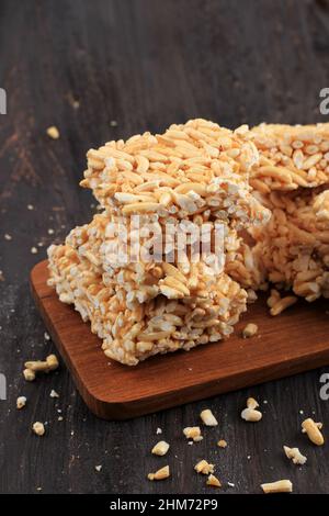 Kue Jipang or Bipang, Javanese Cake Made from Rice Crispy and Sugar, on Wooden Table Stock Photo