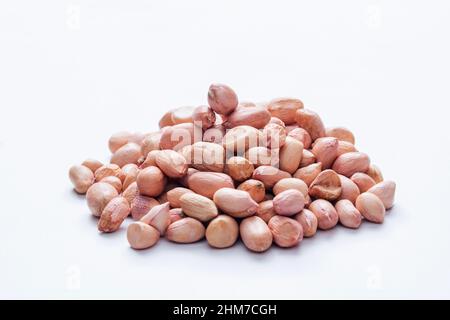Peanuts on white background , Arachis hypogaea Satara, Maharashtra, India Stock Photo