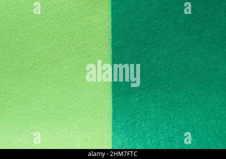 The background is made of felt in two shades of green Stock Photo