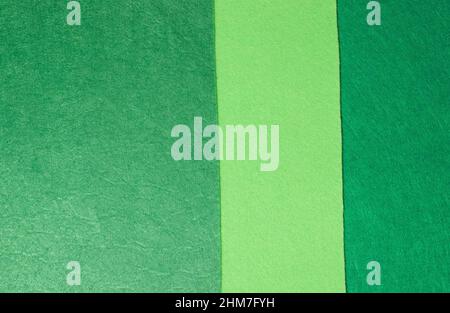 The background is made of felt in three shades of green Stock Photo