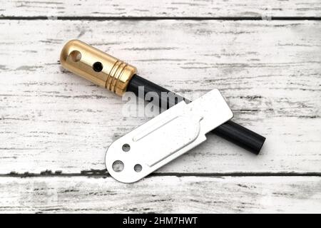 Fire starter, camping equipment on white wooden background Stock Photo