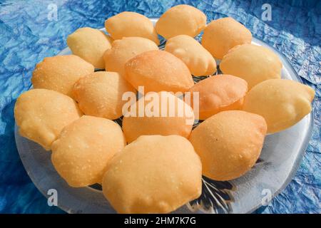 Indian and Pakistani street food item Pani puri or Gol gappa or Puchka. Big size puri used for filling spicy water and potato made of sooji Stock Photo