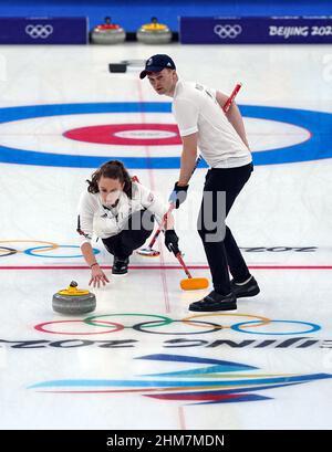 Great Britain's Jennifer Dodds and Bruce Mouat during the Mixed Doubles Bronze Medal match on day four of the Beijing 2022 Winter Olympic Games at the National Aquatics Centre in China. Picture date: Tuesday February 8, 2022. Stock Photo