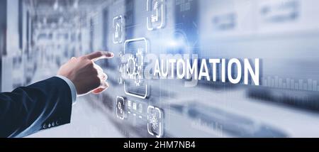 Man clicks on 3d virtual screen Automation. Optimization of business and production processes. Stock Photo