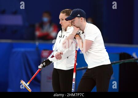 Great Britain's Jennifer Dodds and Bruce Mouat during the Mixed Doubles Bronze Medal match on day four of the Beijing 2022 Winter Olympic Games at the National Aquatics Centre in China. Picture date: Tuesday February 8, 2022. Stock Photo