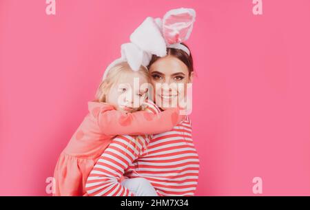 Happy Easter. Girls with bunny ears. Egg hunt. Traditional spring holiday. Stock Photo