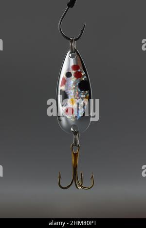 Fishing hook, sharp tip of hook, equipment to catch fish in lake or river  water Stock Photo - Alamy