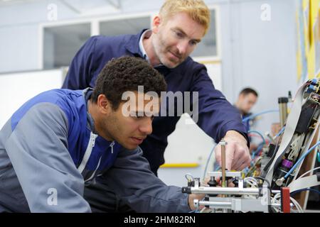 portrait of workers in a machine Stock Photo