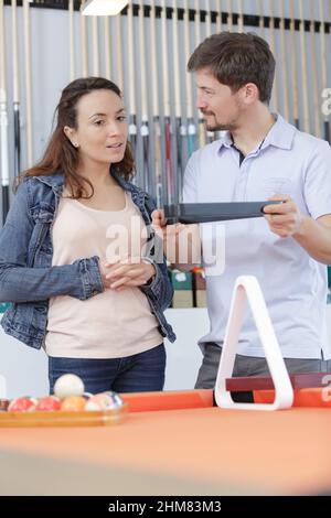 couple choosing a triangle rack Stock Photo