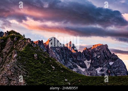 Summits and north rock faces of the Pala group, seen from above Valles Pass at sunrise. Stock Photo